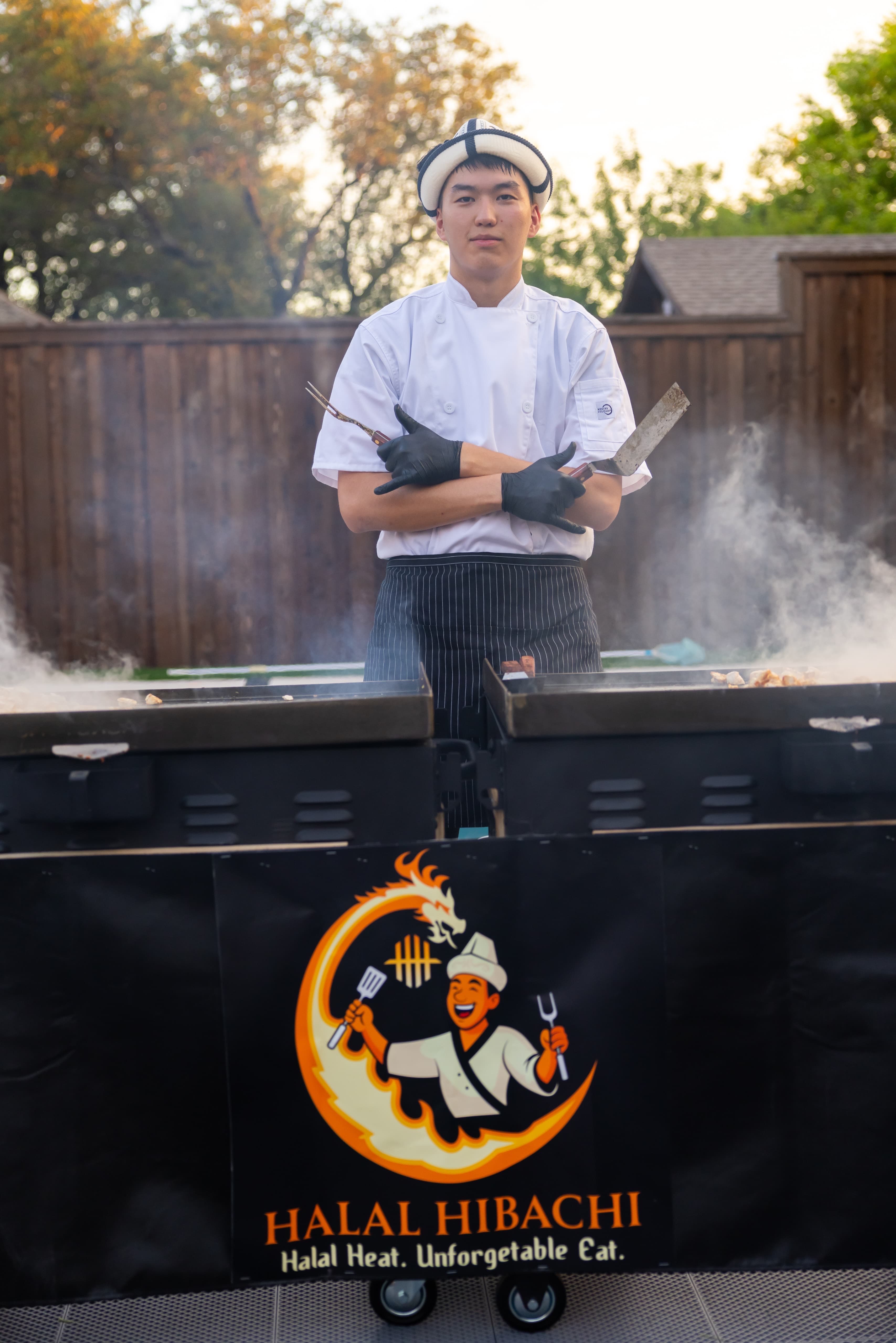 Outdoor hibachi grilling with spectacular fire display